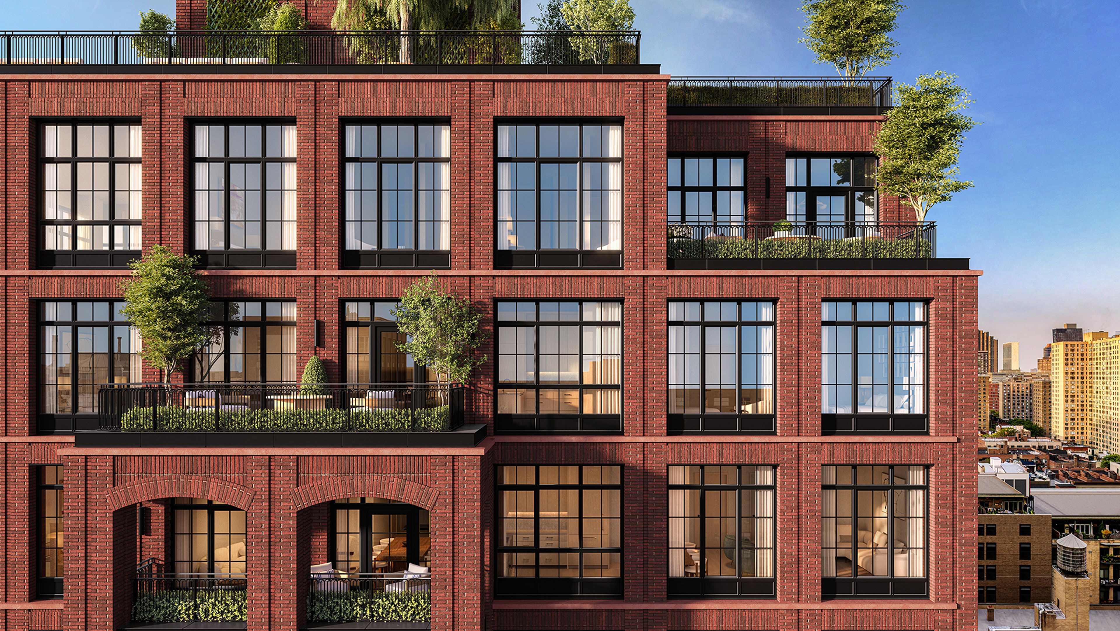 Brick exterior of The Willow Gramercy Residences by Naftali Group featuring outdoor terraces.