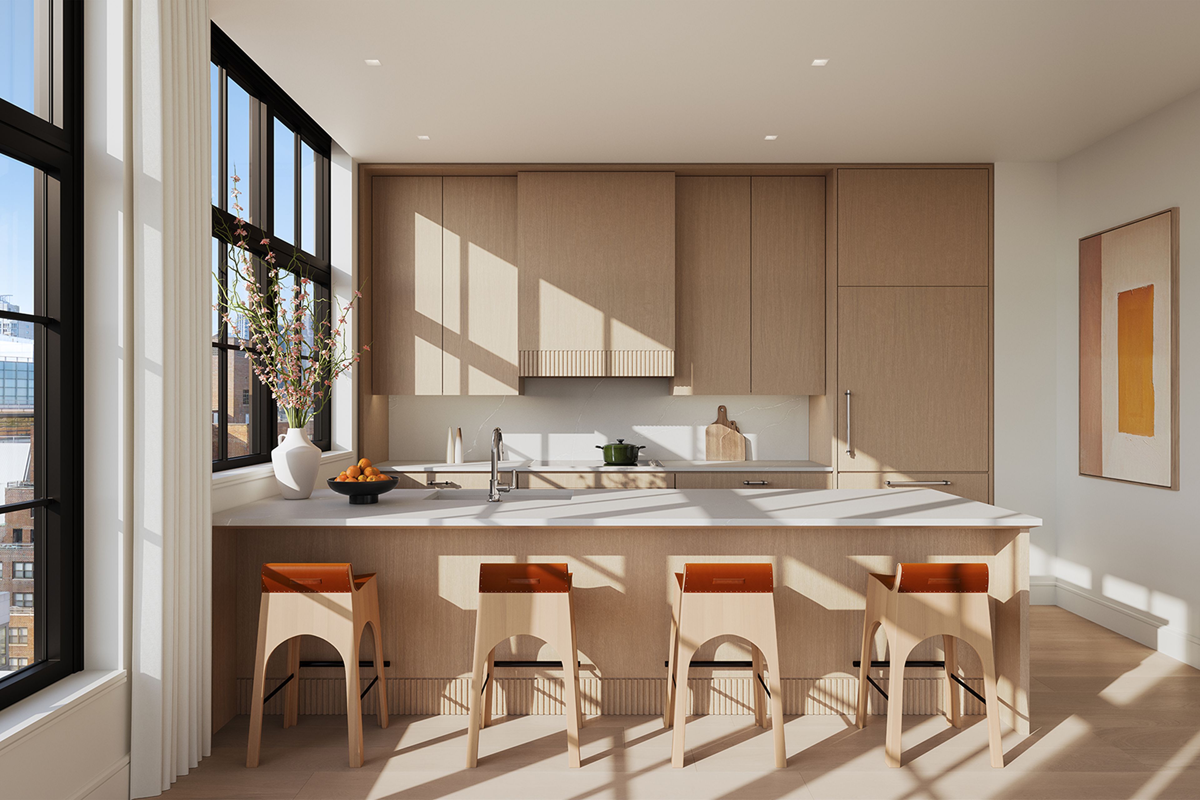 Stylish modern kitchen with kitchen island & large windows at new residences for sale at The Willow Gramercy new development.