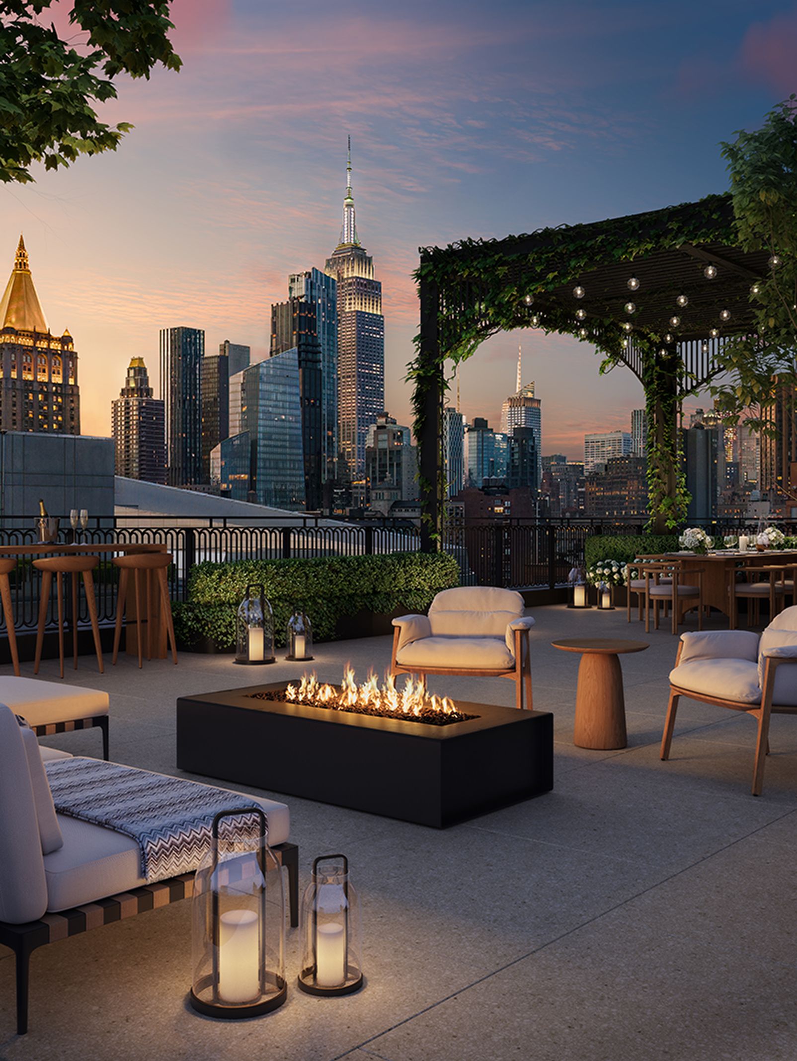Furnished outdoor terrace with firepit and NYC skyline view at The Willow Gramercy luxury homes.
