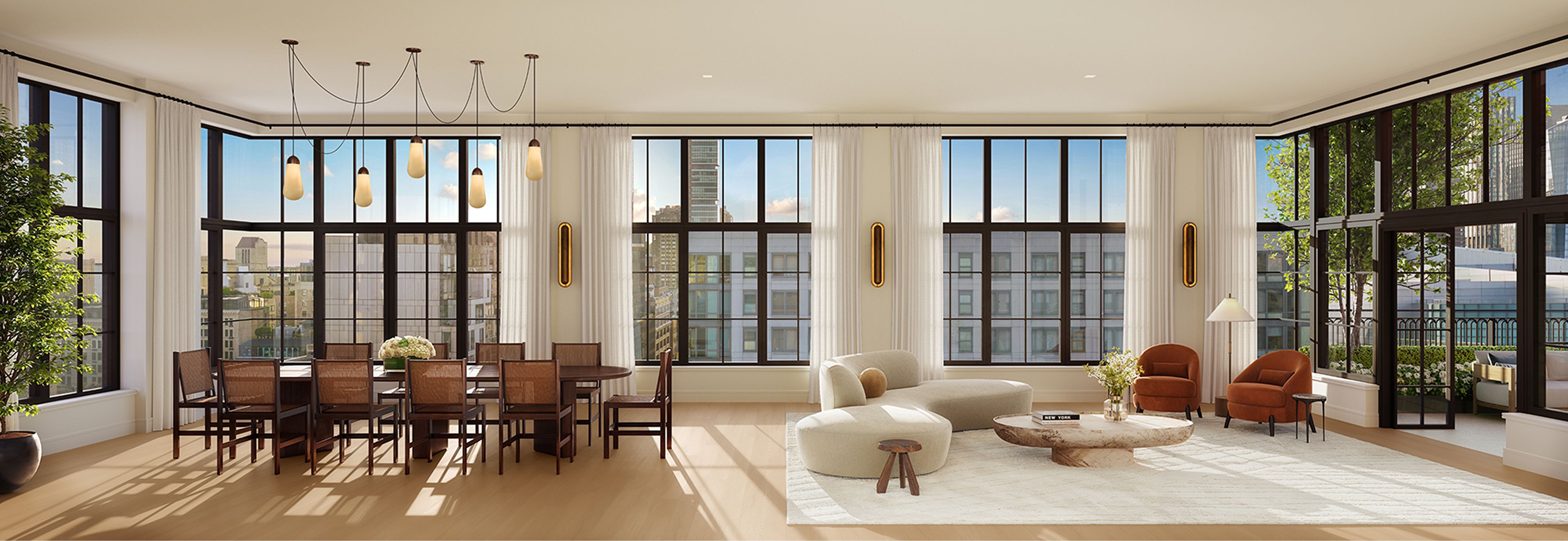 Full-floor penthouse living & entertainment room at The Willow Gramercy Residences with natural light & skyline views.